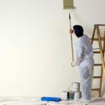a painter painting walls