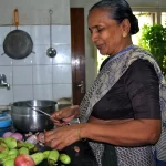 an old lady working in kitchen